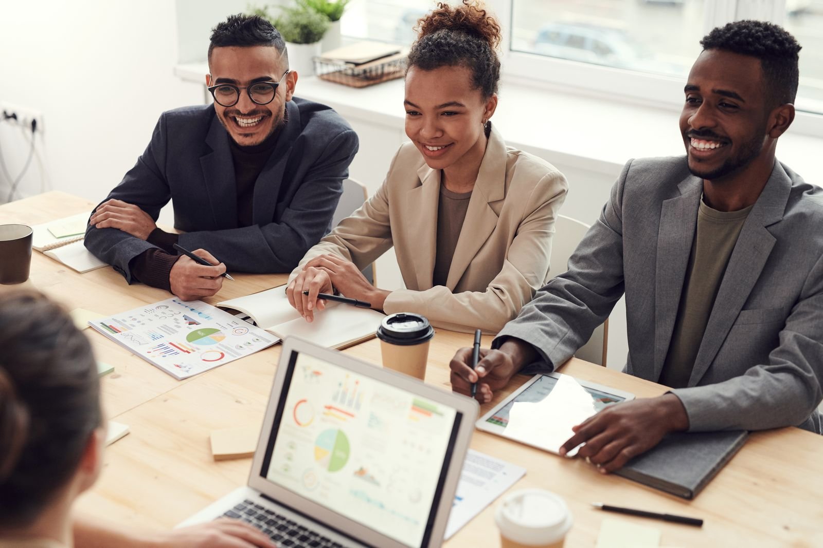 African American adults in a professional office meeting